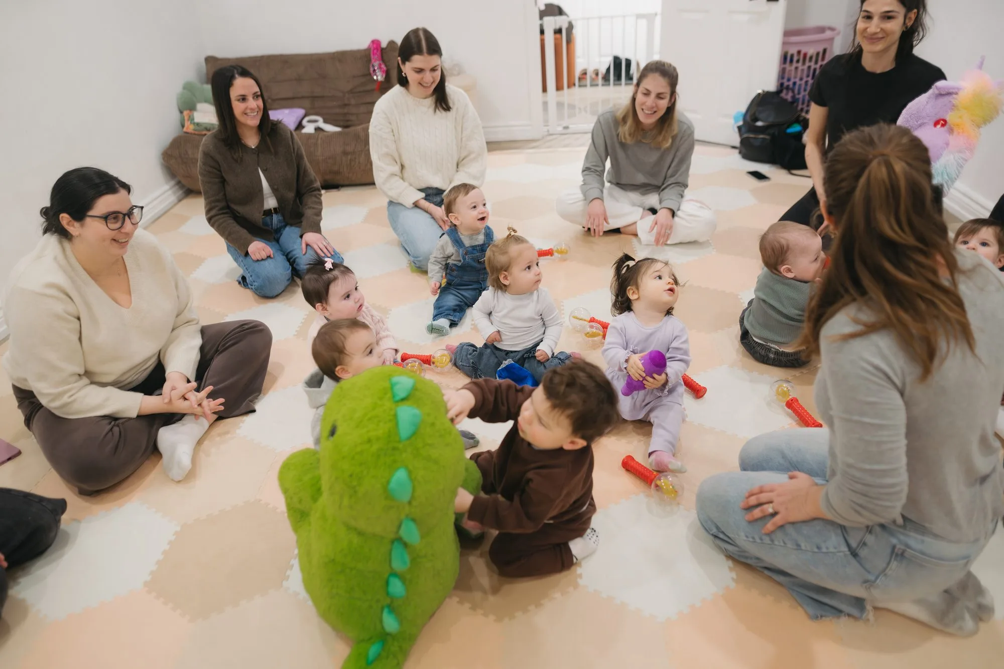 Baby reacting to dragon puppet during a Rockin' with Rach music class