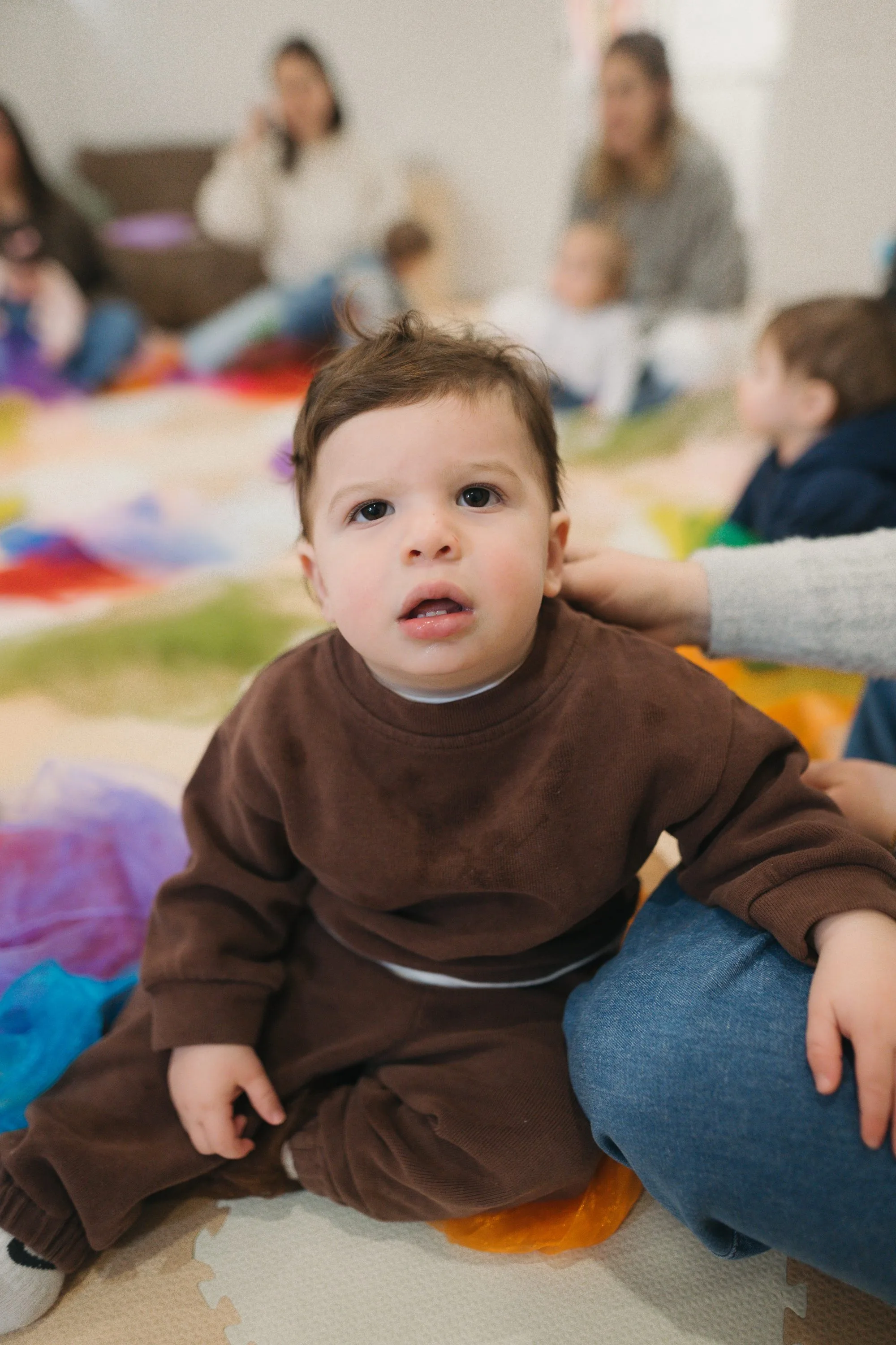 Baby boy with a curious expression at Rockin' with Rach baby music studio Toronto