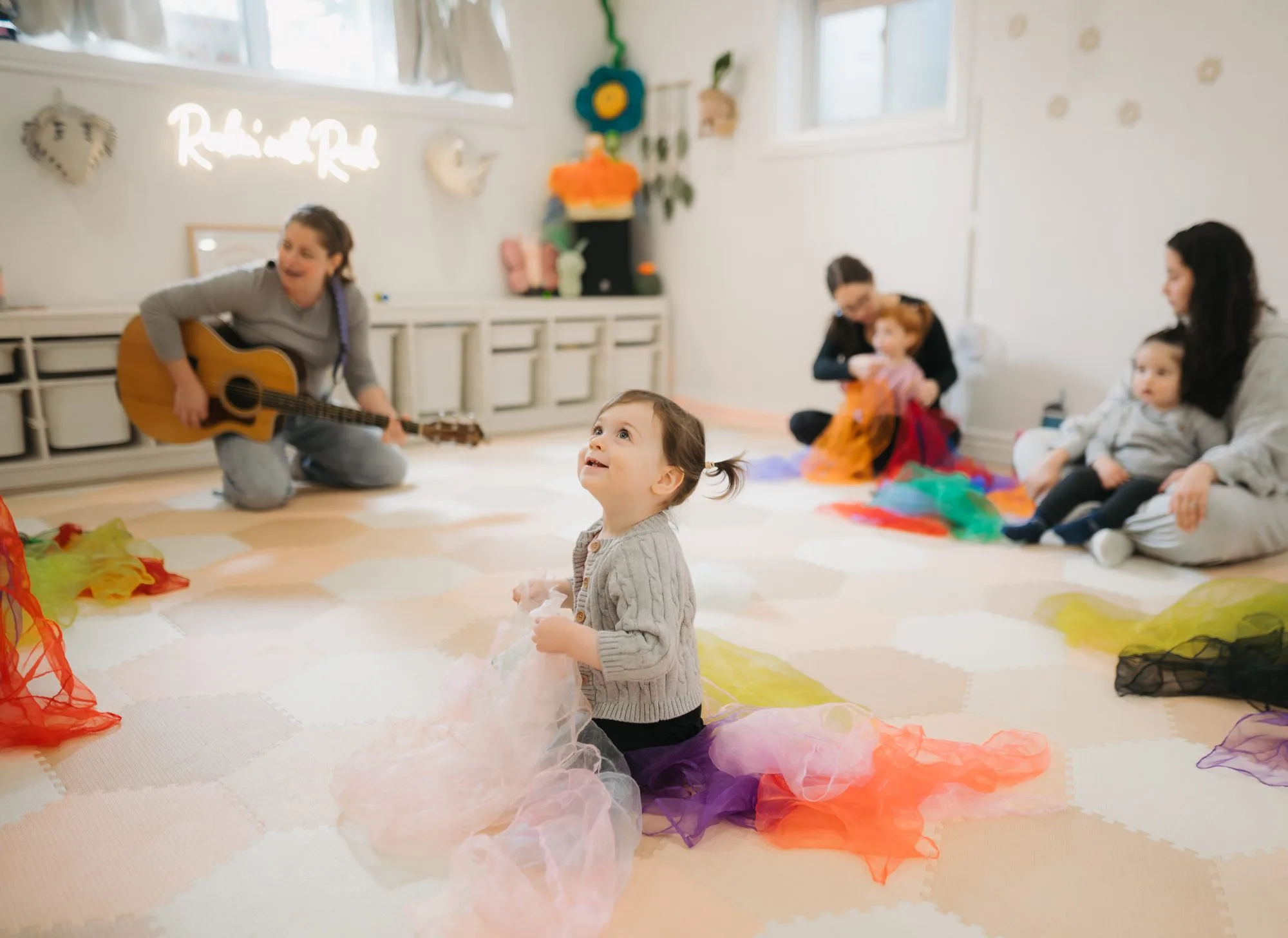 Wide shot of a baby music class at Rockin' with Rach studio Toronto