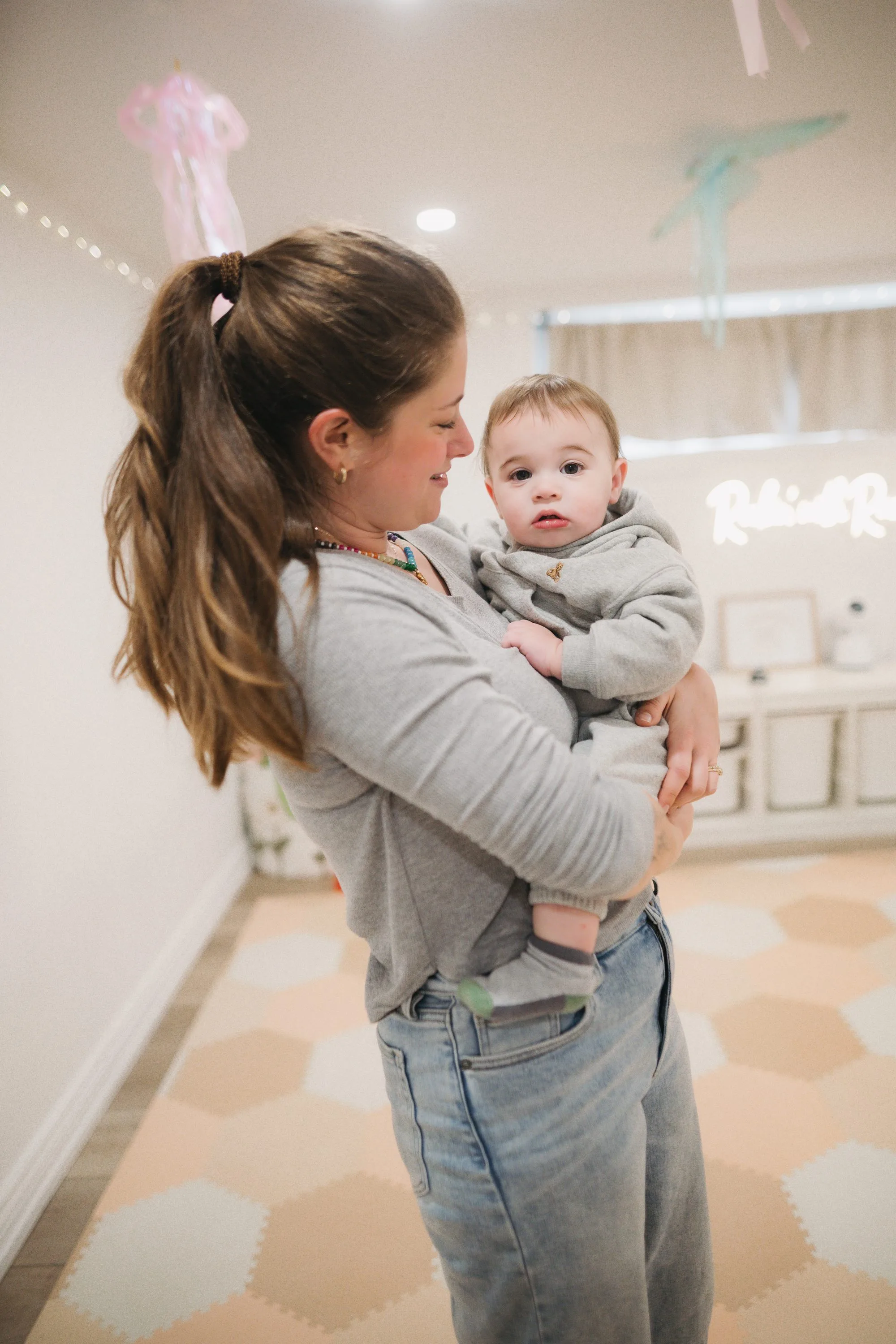 Mom cradling newborn at Rockin' with Rach baby music class Toronto