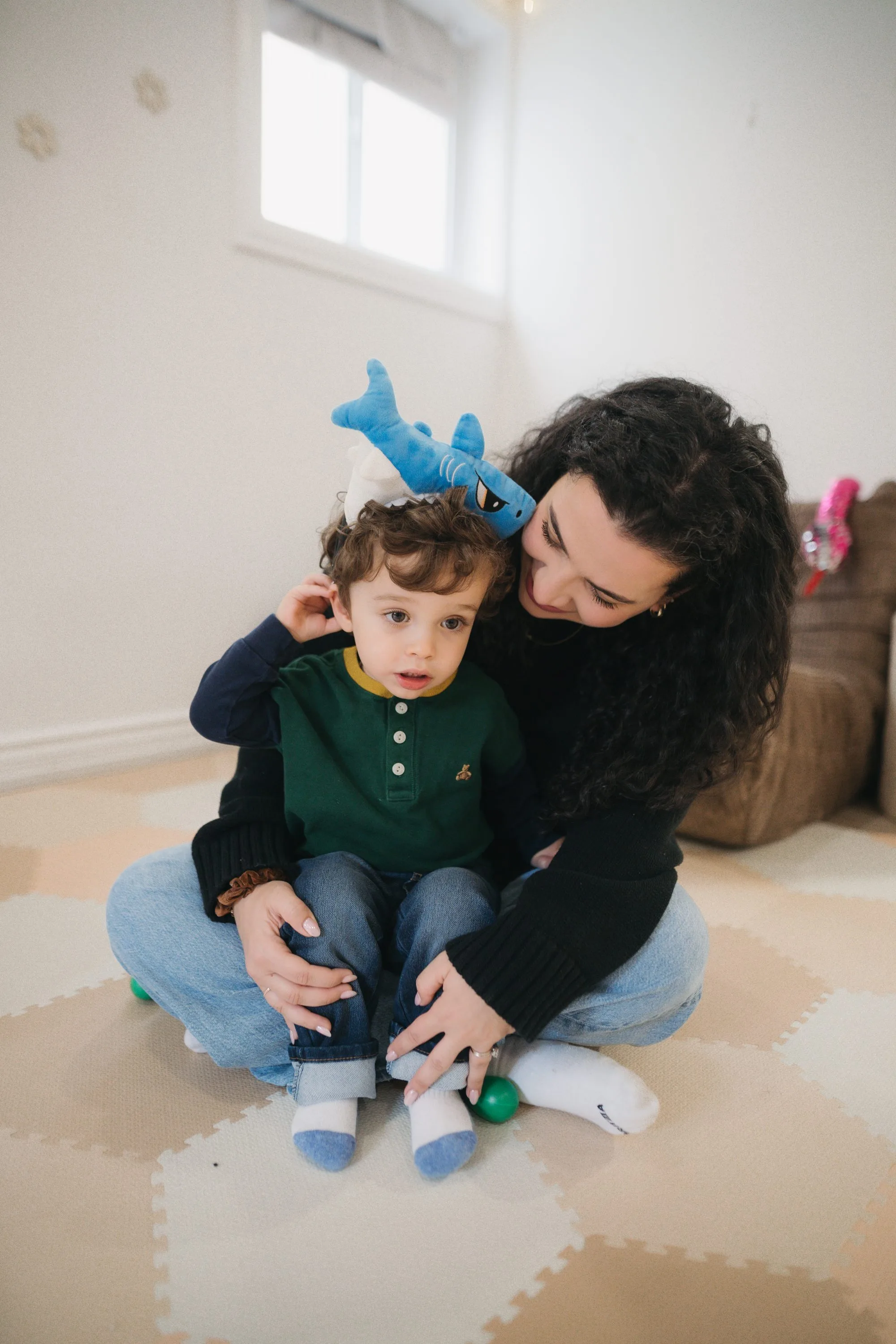 Mom and toddler with shark puppet during a Rockin' with Rach music class
